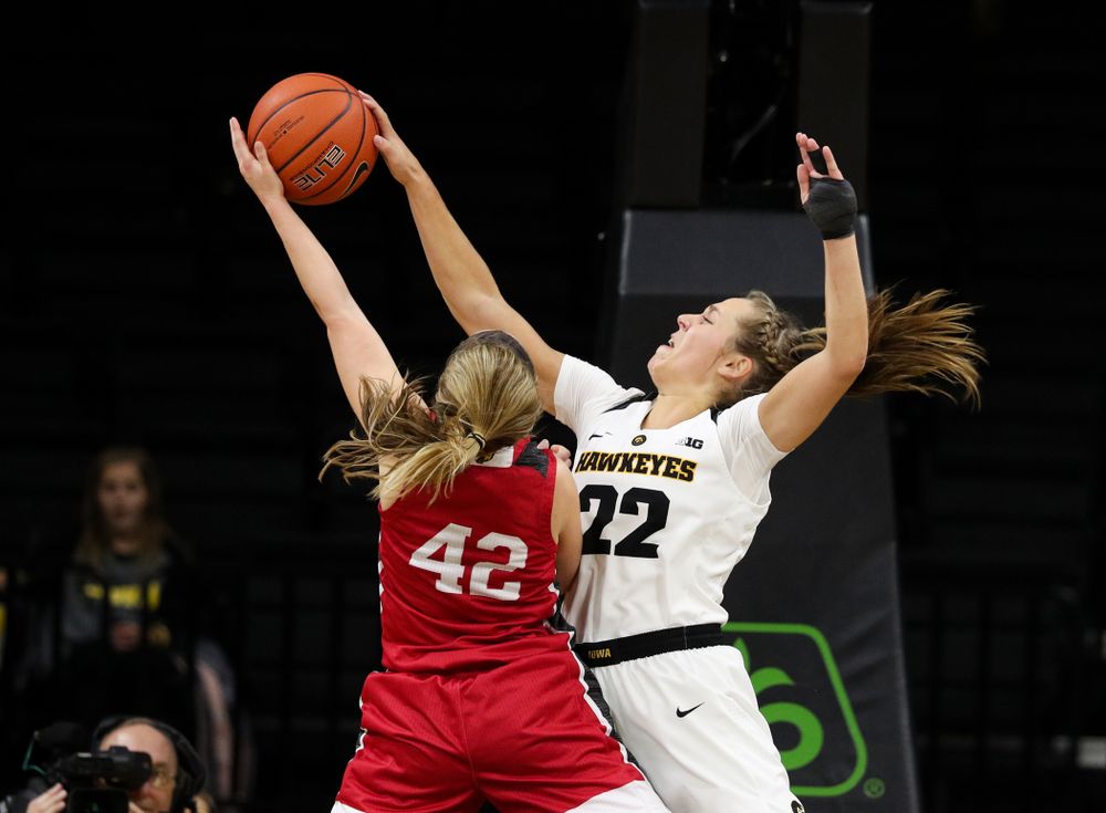 Iowa Hawkeyes guard Kathleen Doyle (22) blocks a shot against the IUPUI Jaguars Saturday, December 8, 2018 at Carver-Hawkeye Arena. (Brian Ray/hawkeyesports.com)