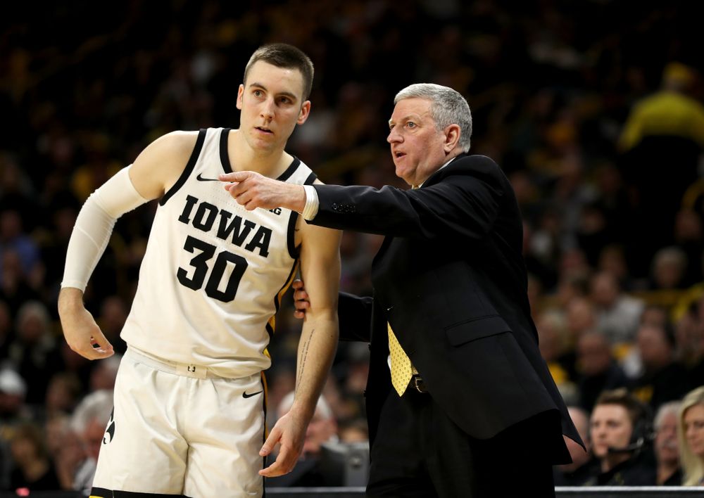 Iowa Hawkeyes guard Connor McCaffery (30) and assistant coach Kirk Speraw against the Ohio State Buckeyes Thursday, February 20, 2020 at Carver-Hawkeye Arena. (Brian Ray/hawkeyesports.com)