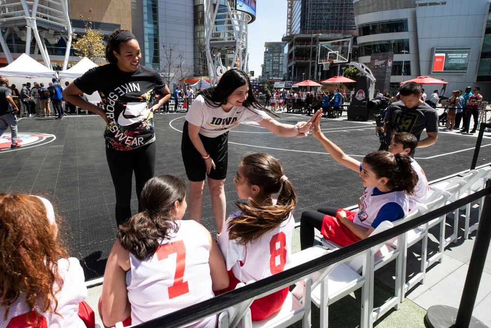 Iowa Hawkeyes forward Megan Gustafson (10) and UCONNÕs Napheesa Collier coach a team during a youth clinic and game Friday, April 12, 2019 in the XBOX Plaza at LA Live. (Brian Ray/hawkeyesports.com)