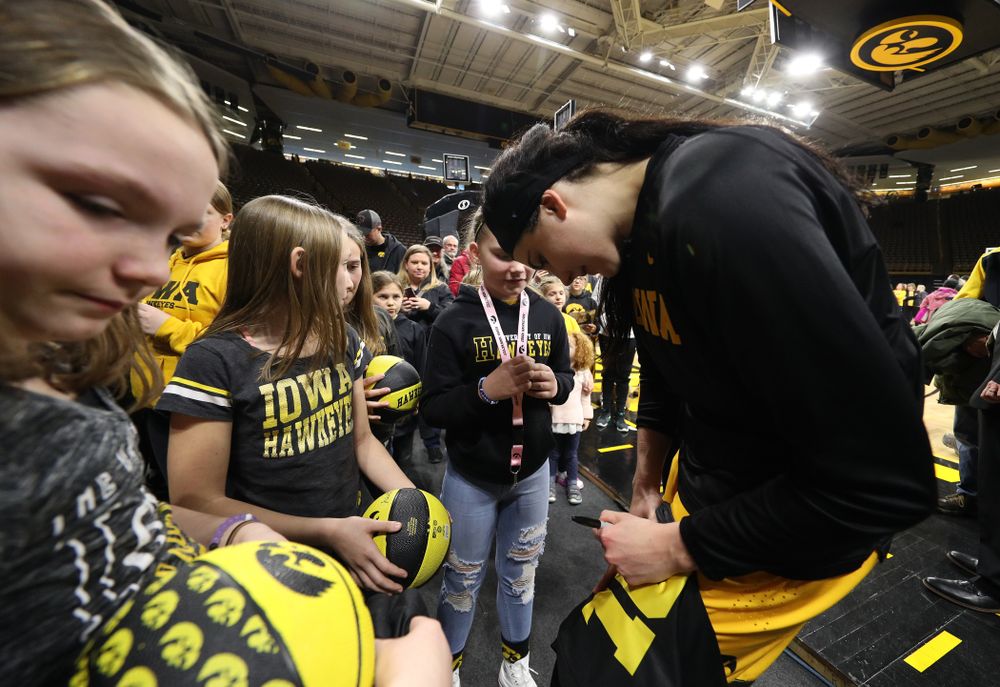 Iowa Hawkeyes forward Megan Gustafson (10) takes, photos, signs autographs, and gives hugs following senior day ceremonies Sunday, March 3, 2019 at Carver-Hawkeye Arena. (Brian Ray/hawkeyesports.com)
