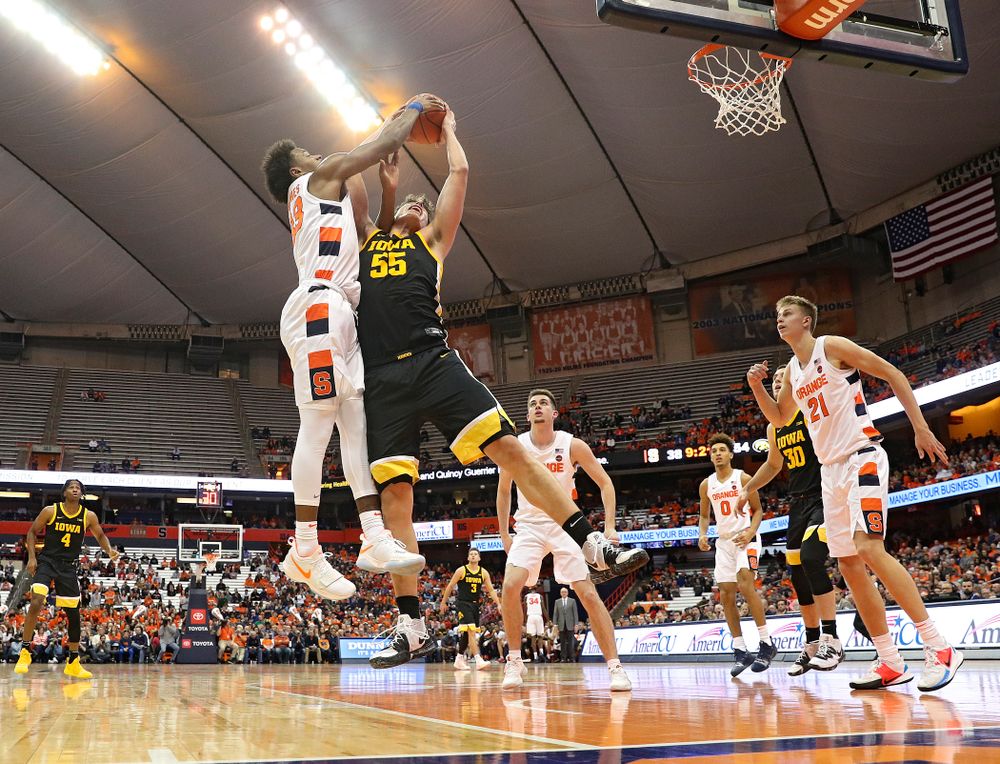 Iowa Hawkeyes center Luka Garza (55) battles for a rebound during the second half of their ACC/Big Ten Challenge game at the Carrier Dome in Syracuse, N.Y. on Tuesday, Dec 3, 2019. (Stephen Mally/hawkeyesports.com)