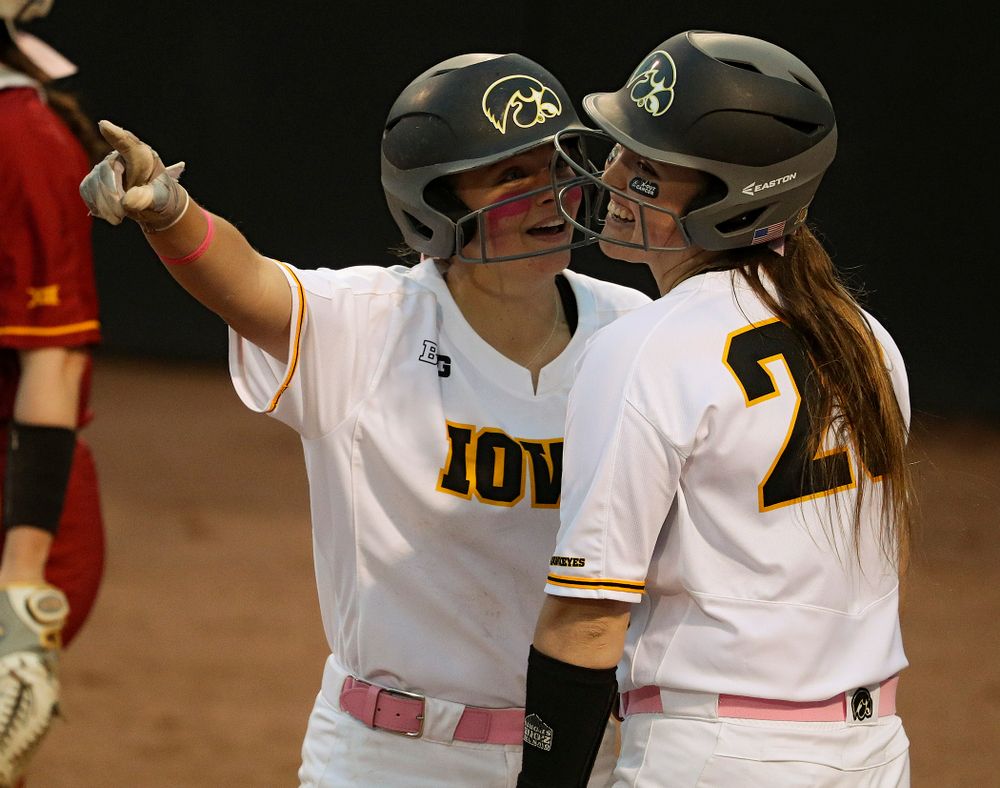 Iowa catcher Abby Lien (from left) talks with Miranda Schulte before Schulte's at bat during the fifth inning of their game against Iowa State at Pearl Field in Iowa City on Tuesday, Apr. 9, 2019. (Stephen Mally/hawkeyesports.com)
