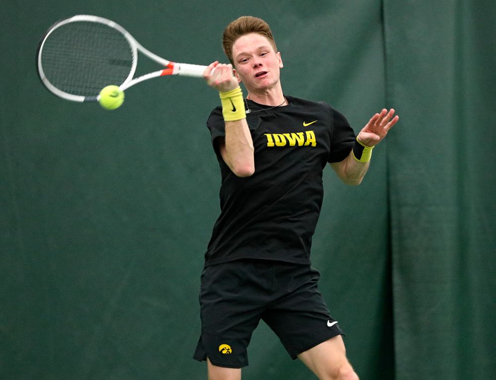 Iowa’s Jason Kerst returns a shot during his singles match at the Hawkeye Tennis and Recreation Complex in Iowa City on Friday, February 14, 2020. (Stephen Mally/hawkeyesports.com)