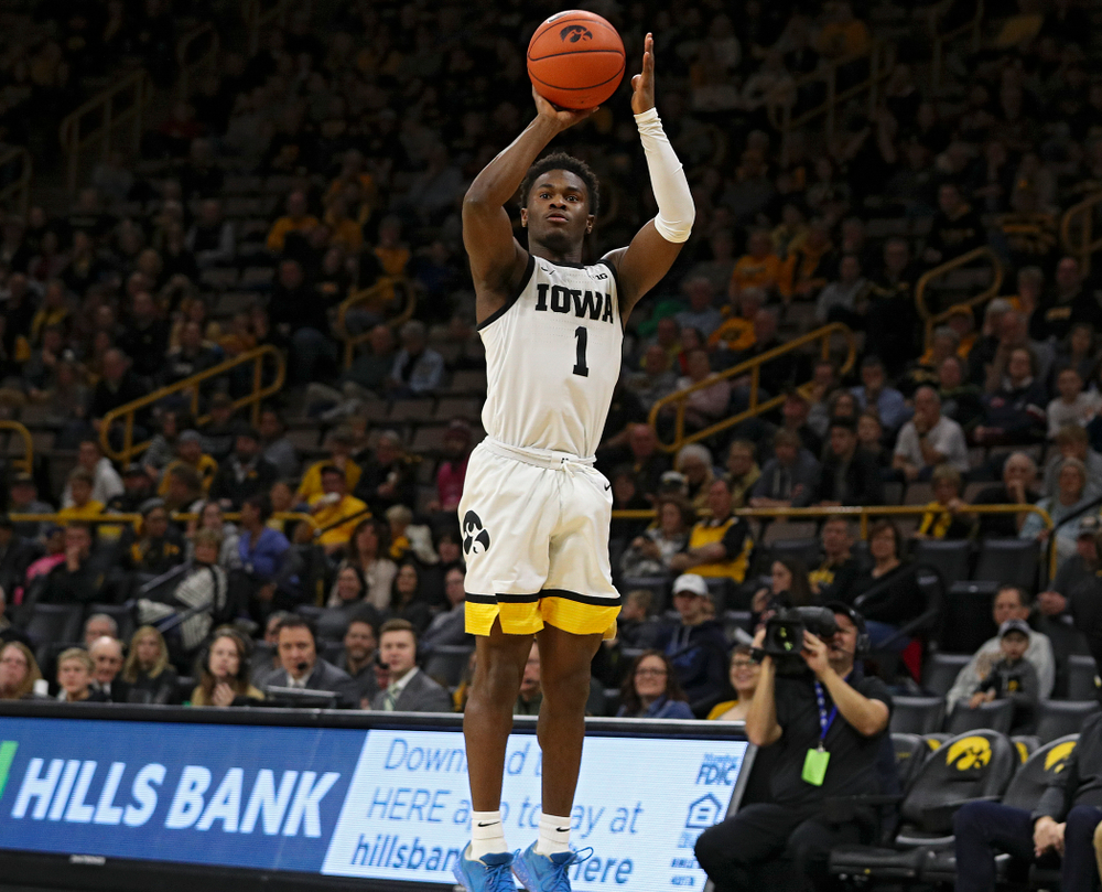 Iowa Hawkeyes guard Joe Toussaint (1) lines up a shot during the first half of their game at Carver-Hawkeye Arena in Iowa City on Sunday, Nov 24, 2019. (Stephen Mally/hawkeyesports.com)