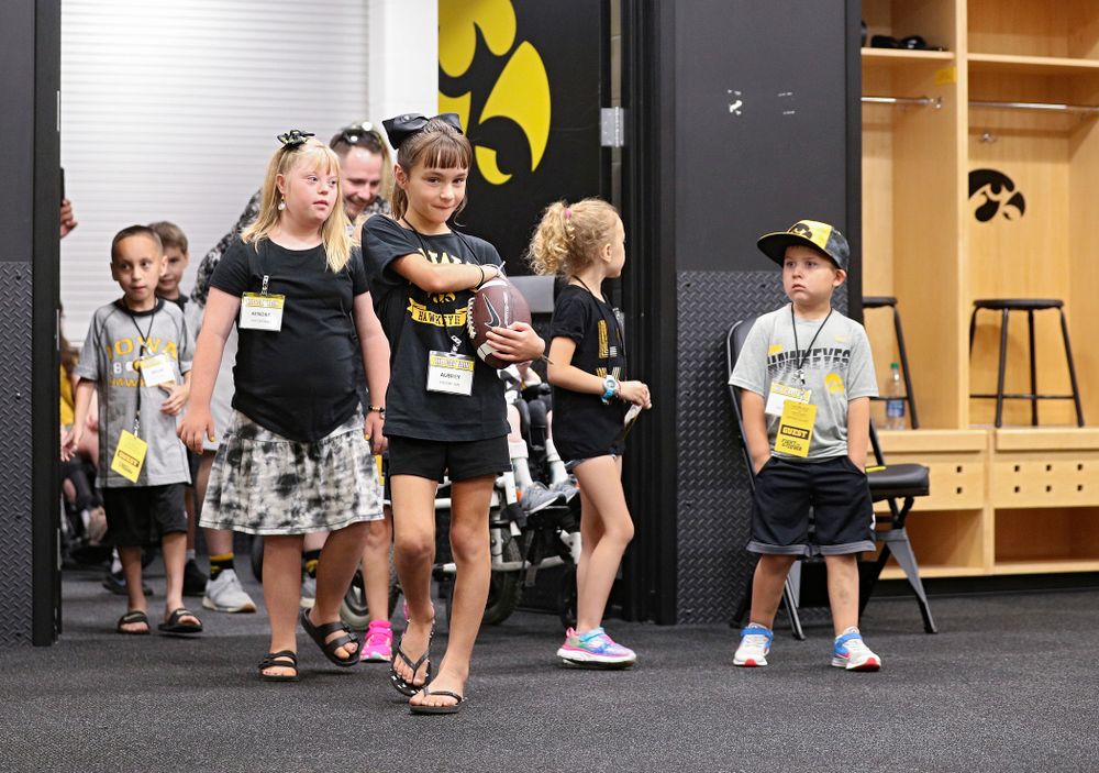 Kid Captains enter the Iowa locker room during Kids Day at Kinnick Stadium in Iowa City on Saturday, Aug 10, 2019. (Stephen Mally/hawkeyesports.com)