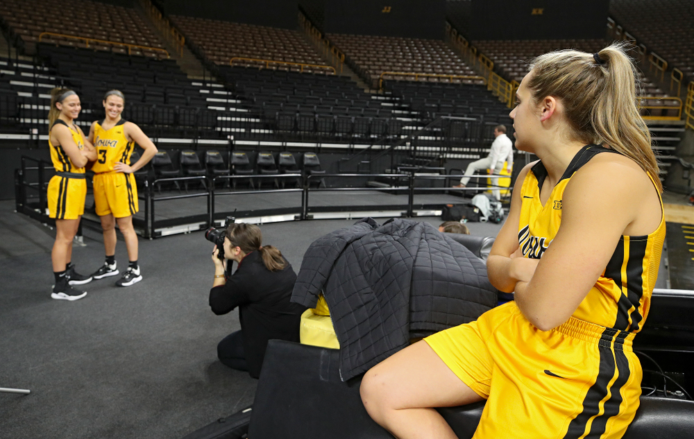 Iowa guard Kathleen Doyle (22) looks on as guard Megan Meyer (11) and guard Makenzie Meyer (3) pose for a picture during Iowa Women’s Basketball Media Day at Carver-Hawkeye Arena in Iowa City on Thursday, Oct 24, 2019. (Stephen Mally/hawkeyesports.com)