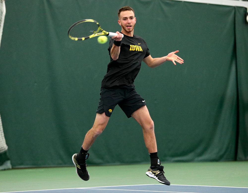 Iowa’s Kareem Allaf returns a shot during his singles match at the Hawkeye Tennis and Recreation Complex in Iowa City on Friday, February 14, 2020. (Stephen Mally/hawkeyesports.com)