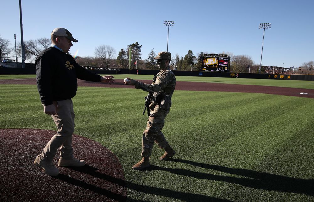 Members of the University of Iowa ROTC deliver the game ball before the Iowa Hawkeyes game against the Nebraska Cornhuskers on Military Appreciation Night Friday, April 19, 2019 at Duane Banks Field. (Brian Ray/hawkeyesports.com)