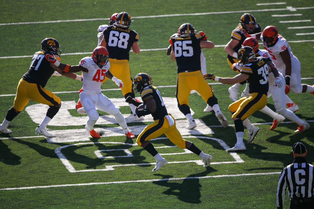 Iowa Hawkeyes running back Tyler Goodson (15), Iowa Hawkeyes offensive lineman Tyler Linderbaum (65) and Iowa Hawkeyes offensive lineman Landan Paulsen (68) during Iowa football vs Illinois on Saturday, November 23, 2019 at Kinnick Stadium. (Lily Smith/hawkeyesports.com)