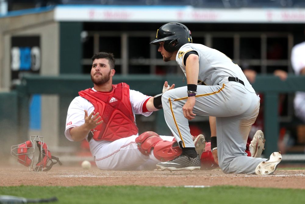 Iowa Hawkeyes outfielder Ben Norman (9) scores against the Indiana Hoosiers in the first round of the Big Ten Baseball Tournament Wednesday, May 22, 2019 at TD Ameritrade Park in Omaha, Neb. (Brian Ray/hawkeyesports.com)