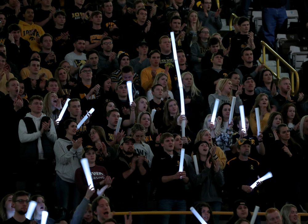 Fans wave glow sticks as the Iowa Hawkeyes wrestle Ohio State Friday, January 24, 2020 at Carver-Hawkeye Arena. (Brian Ray/hawkeyesports.com)