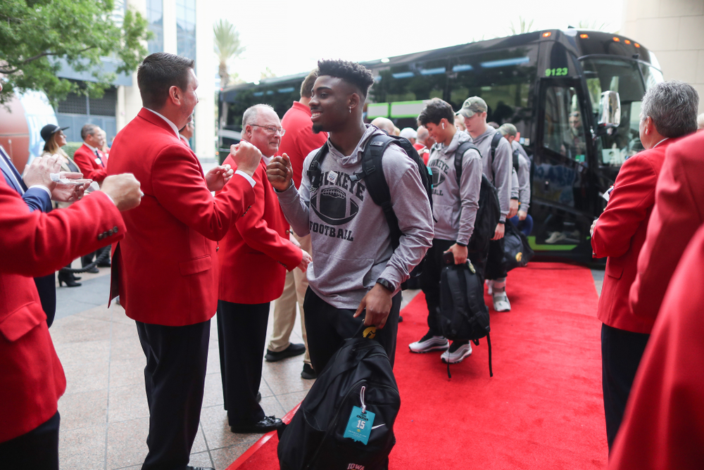 Iowa Hawkeyes running back Tyler Goodson (15) shakes hands with the ÒRed CoatsÓ after arriving in San Diego, CA Saturday, December 21, 2019 for the Holiday Bowl. (Brian Ray/hawkeyesports.com)