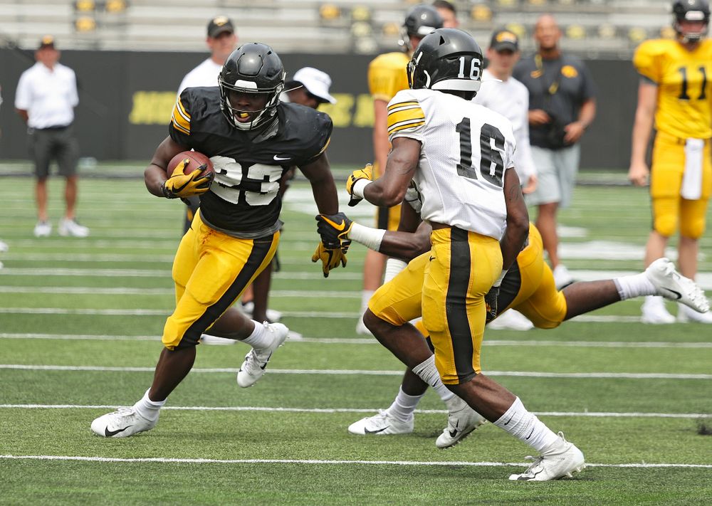 Iowa Hawkeyes running back Shadrick Byrd (23) tries to get around the end during Fall Camp Practice No. 8 at Kids Day at Kinnick Stadium in Iowa City on Saturday, Aug 10, 2019. (Stephen Mally/hawkeyesports.com)