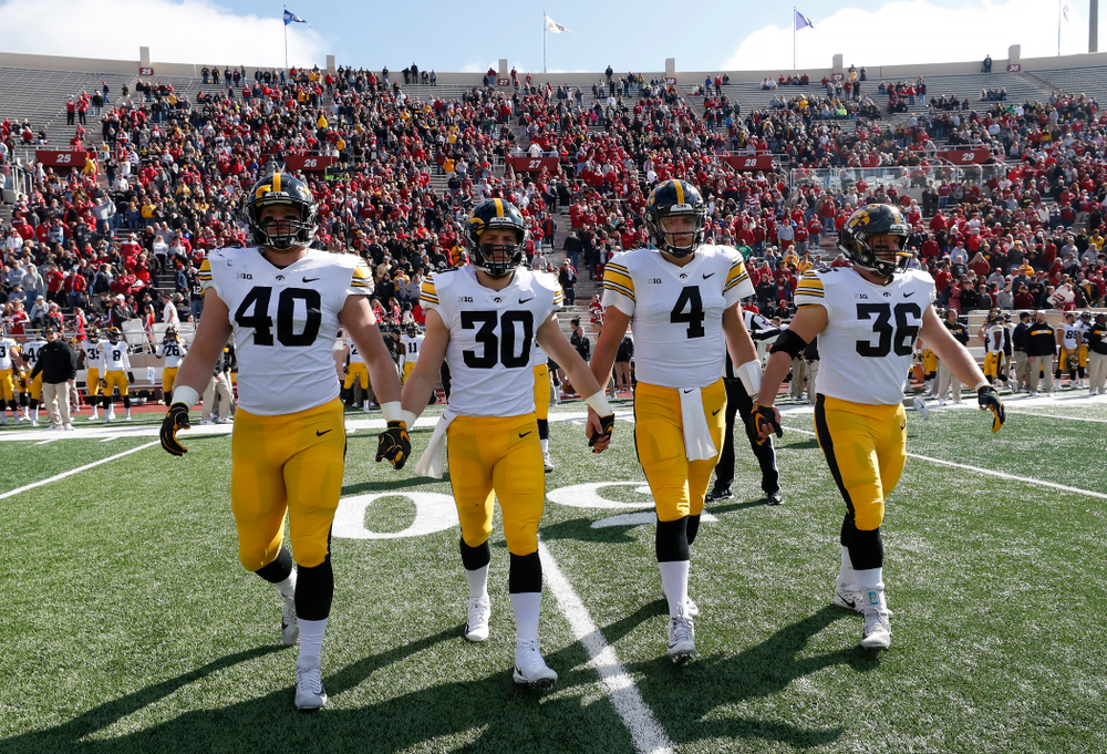 Iowa Hawkeyes captains defensive end Parker Hesse (40), defensive back Jake Gervase (30), quarterback Nate Stanley (4), and fullback Brady Ross against the Indiana Hoosiers Saturday, October 13, 2018 at Memorial Stadium, in Bloomington, Ind. (Brian Ray/hawkeyesports.com)