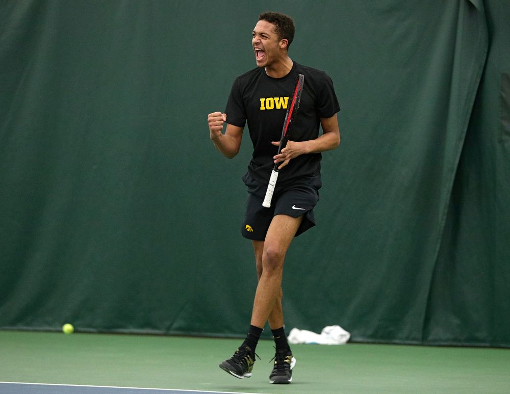 Iowa’s Oliver Okonkwo celebrates a point during his singles match at the Hawkeye Tennis and Recreation Complex in Iowa City on Friday, March 6, 2020. (Stephen Mally/hawkeyesports.com)
