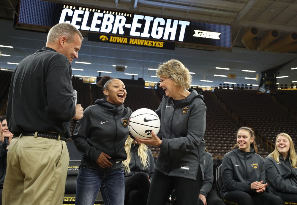Iowa Hawkeyes head coach Lisa Bluder presents guard Tania Davis (11) with a ball commemorating her 1,00th point during the teamÕs Celebr-Eight event Wednesday, April 24, 2019 at Carver-Hawkeye Arena. (Brian Ray/hawkeyesports.com)