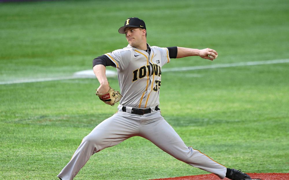 Iowa Hawkeyes pitcher Cam Baumann (35) delivers to the plate during the eighth inning of their CambriaCollegeClassic game at U.S. Bank Stadium in Minneapolis, Minn. on Friday, February 28, 2020. (Stephen Mally/hawkeyesports.com)