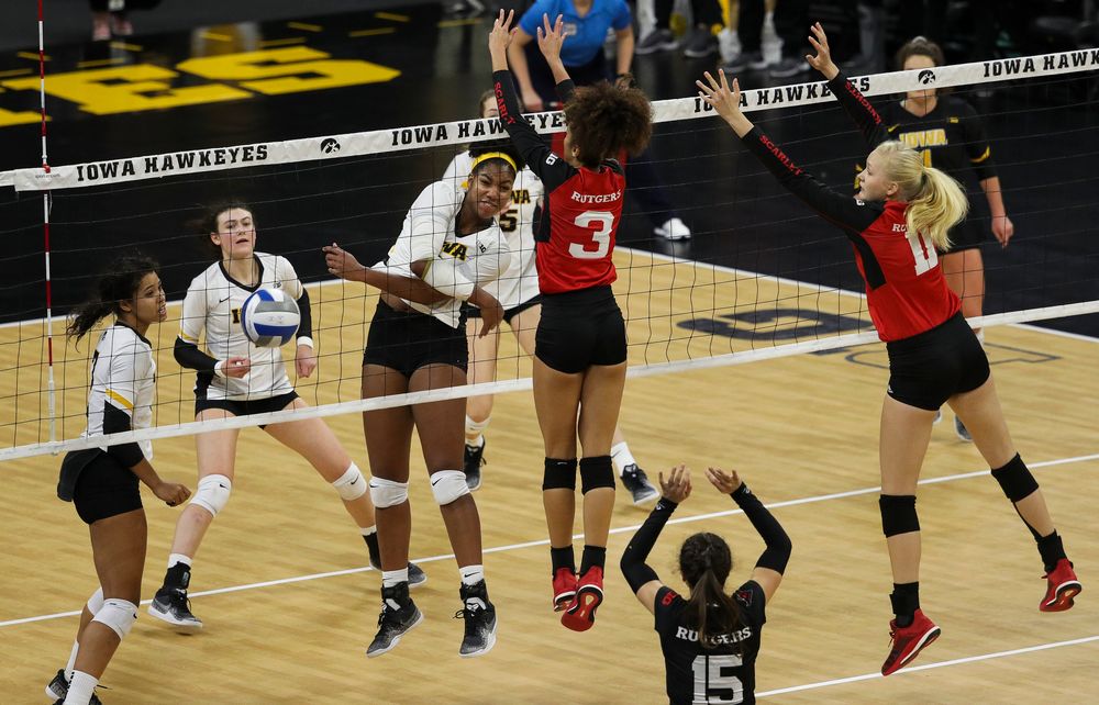 Iowa Hawkeyes middle blocker Amiya Jones (9) spikes the ball for match point during a match against Rutgers at Carver-Hawkeye Arena on November 2, 2018. (Tork Mason/hawkeyesports.com)