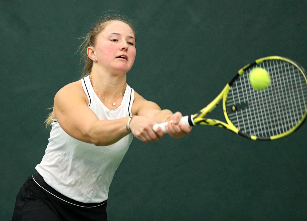 Iowa’s Danielle Burich returns a shot during her doubles match at the Hawkeye Tennis and Recreation Complex in Iowa City on Sunday, February 16, 2020. (Stephen Mally/hawkeyesports.com)