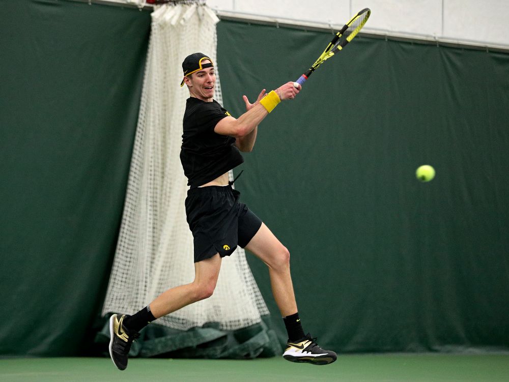 Iowa’s Nikita Snezhko returns a shot during his singles match at the Hawkeye Tennis and Recreation Complex in Iowa City on Friday, March 6, 2020. (Stephen Mally/hawkeyesports.com)