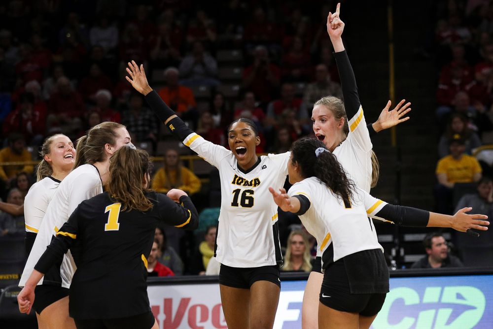 Iowa Hawkeyes outside hitter Taylor Louis (16) and Iowa Hawkeyes middle blocker Hannah Clayton (18) celebrate after winning a point during a match against Nebraska at Carver-Hawkeye Arena on November 7, 2018. (Tork Mason/hawkeyesports.com)