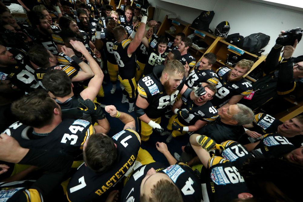The Iowa Hawkeyes do the Hokey Pokey in the locker room to honor the late Hayden Fry following their win against USC in the Holiday Bowl Saturday, December 28, 2019 at San Diego Community Credit Union Stadium. (Brian Ray/hawkeyesports.com)
