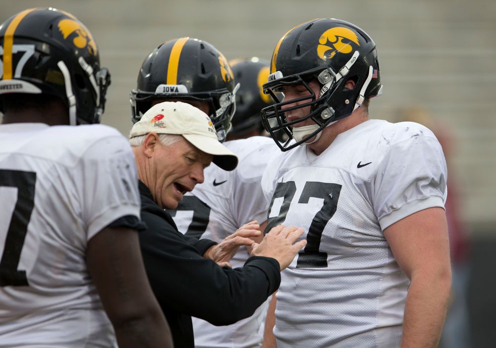 Iowa Hawkeyes defensive line coach Reese Morgan works with defensive lineman Wil Rathjen (87) during spring practice Wednesday, April 16, 2014 at the Kinnick Stadium in Iowa City. (Brian Ray/hawkeyesports.com)