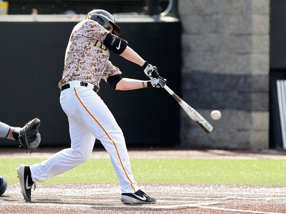 Iowa Hawkeyes first baseman Zeb Adreon (5) drives a pitch for a hit during the ninth inning of their game against UC Irvine at Duane Banks Field in Iowa City on Sunday, May. 5, 2019. (Stephen Mally/hawkeyesports.com)