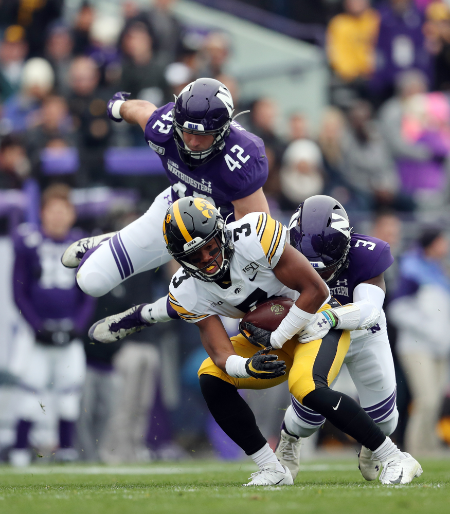 Iowa Hawkeyes wide receiver Tyrone Tracy Jr. (3) spins out of a tackle on his way to a touchdown against the Northwestern Wildcats Saturday, October 26, 2019 at Ryan Field in Evanston, Ill. (Brian Ray/hawkeyesports.com)