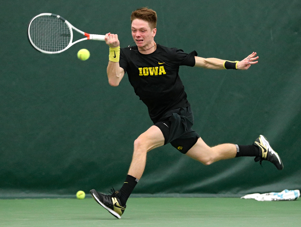 Iowa’s Jason Kerst returns a shot during his singles match at the Hawkeye Tennis and Recreation Complex in Iowa City on Friday, February 14, 2020. (Stephen Mally/hawkeyesports.com)