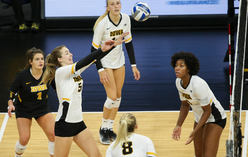 Iowa Hawkeyes outside hitter Meghan Buzzerio (5) sets the ball over the net during a game against Purdue at Carver-Hawkeye Arena on October 13, 2018. (Tork Mason/hawkeyesports.com)