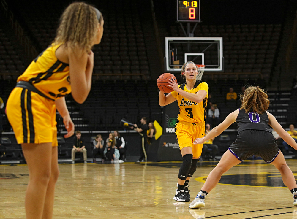 Iowa guard Makenzie Meyer (3) looks to pass to guard Gabbie Marshall (24) during the second quarter of their game against Winona State at Carver-Hawkeye Arena in Iowa City on Sunday, Nov 3, 2019. (Stephen Mally/hawkeyesports.com)