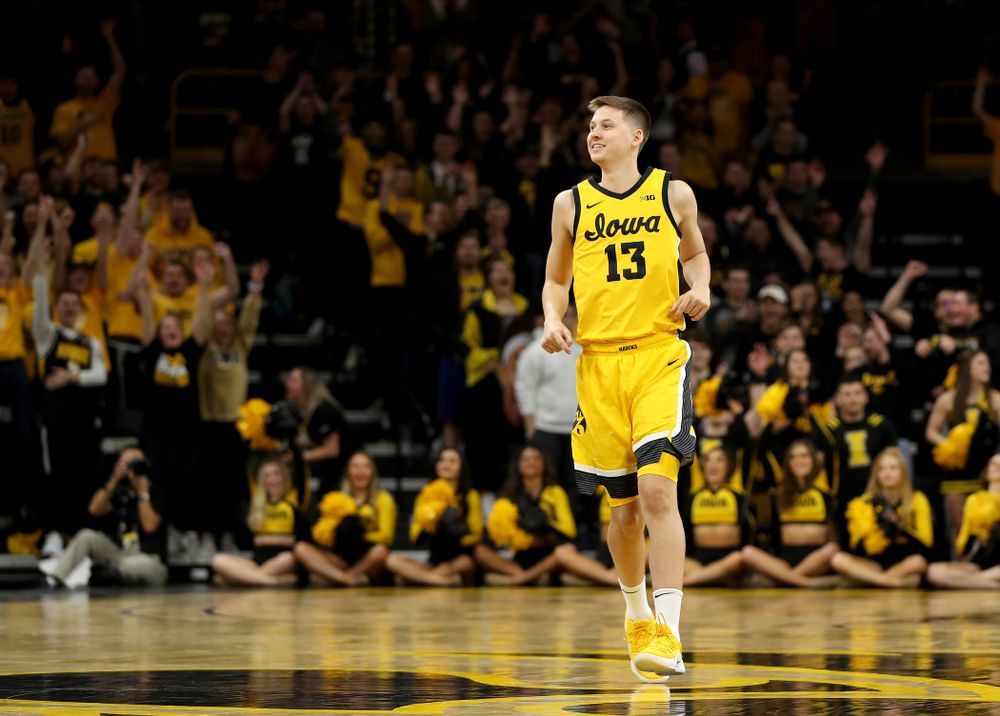 Iowa Hawkeyes guard Austin Ash (13) celebrates a three point basket against the Nebraska Cornhuskers Saturday, February 8, 2020 at Carver-Hawkeye Arena. (Brian Ray/hawkeyesports.com)