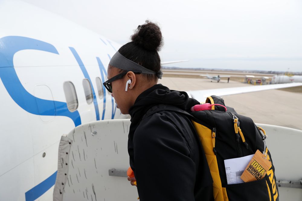 Iowa Hawkeyes guard Tania Davis (11) boards the team plane to Greensboro, NC for the Regionals of the 2019 NCAA Women's Basketball Championships Thursday, March 28, 2019 at the Eastern Iowa Airport. (Brian Ray/hawkeyesports.com)