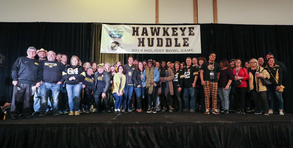 Parents and relatives of members of the Hawkeye Football team stand on stage during the Holiday Bowl Hawkeye Huddle Thursday, December 26, 2019 at the Hilton in downtown San Diego. (Brian Ray/hawkeyesports.com)