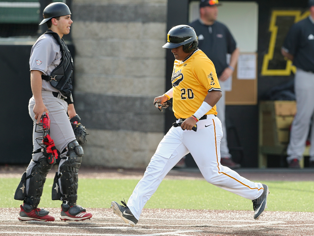 Iowa Hawkeyes first baseman Izaya Fullard (20) scores a run during the third inning of their game against Northern Illinois at Duane Banks Field in Iowa City on Tuesday, Apr. 16, 2019. (Stephen Mally/hawkeyesports.com)