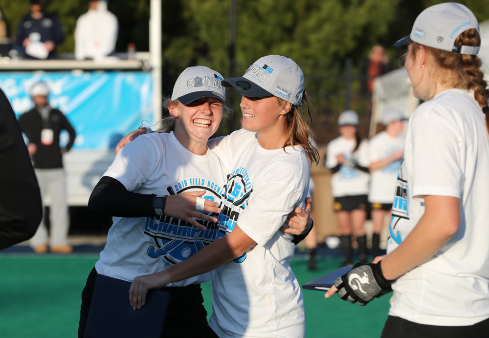 Iowa Hawkeyes Katie Birch (11) and Sophie Sunderland (20) hug after being named to the all tournament team following their victory over Penn State in the 2019 Big Ten Field Hockey Tournament Championship Game Sunday, November 10, 2019 in State College. (Brian Ray/hawkeyesports.com)