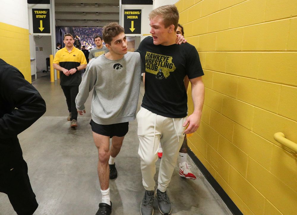 Iowa’s Austin DeSanto (from left) talks with Nelson Brands after their dual at Carver-Hawkeye Arena in Iowa City on Friday, January 31, 2020. (Stephen Mally/hawkeyesports.com)