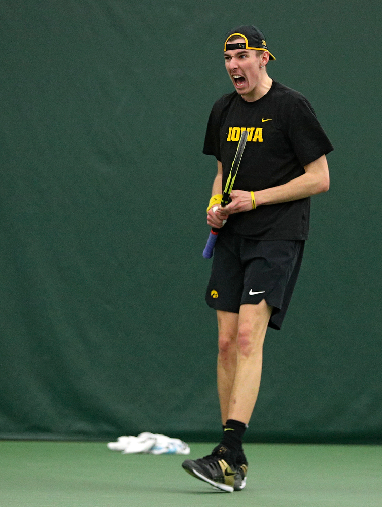 Iowa’s Nikita Snezhko celebrates a point during his singles match at the Hawkeye Tennis and Recreation Complex in Iowa City on Friday, March 6, 2020. (Stephen Mally/hawkeyesports.com)