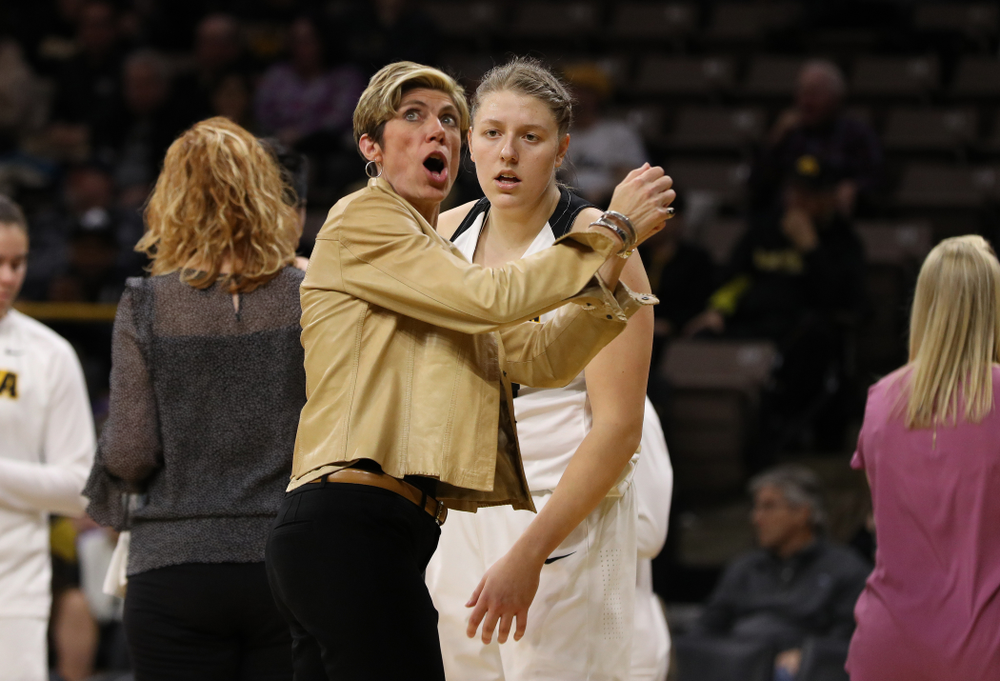Associate head coach Jan Jensen and forward/center Monika Czinano (25) against the Illinois Fighting Illini Thursday, February 14, 2019 at Carver-Hawkeye Arena. (Brian Ray/hawkeyesports.com)