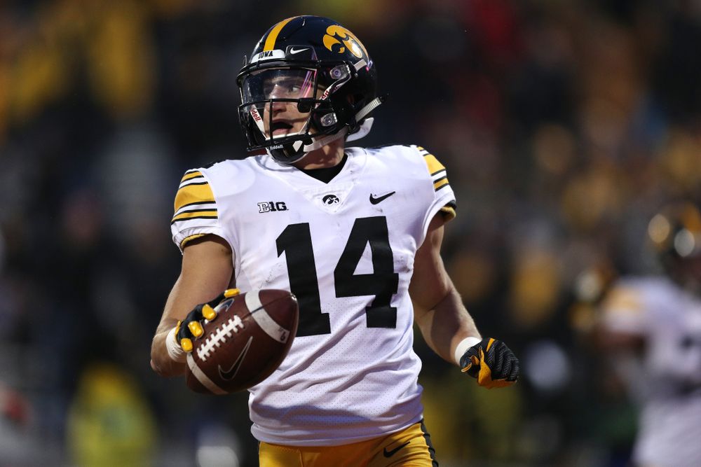 Iowa Hawkeyes wide receiver Kyle Groeneweg (14) returns a punt for a touchdown against the Illinois Fighting Illini Saturday, November 17, 2018 at Memorial Stadium in Champaign, Ill. (Brian Ray/hawkeyesports.com)