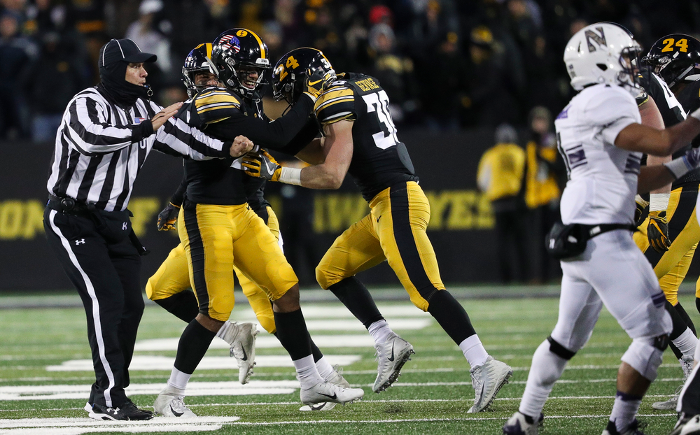 Iowa Hawkeyes defensive back Amani Hooker (27) and Iowa Hawkeyes defensive back Jake Gervase (30) celebrate after Gervase's interception during a game against Northwestern at Kinnick Stadium on November 10, 2018. (Tork Mason/hawkeyesports.com)