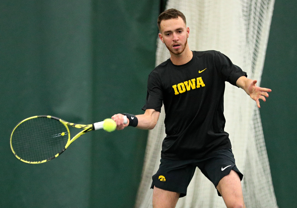 Iowa’s Kareem Allaf returns a shot during his singles match at the Hawkeye Tennis and Recreation Complex in Iowa City on Friday, February 14, 2020. (Stephen Mally/hawkeyesports.com)