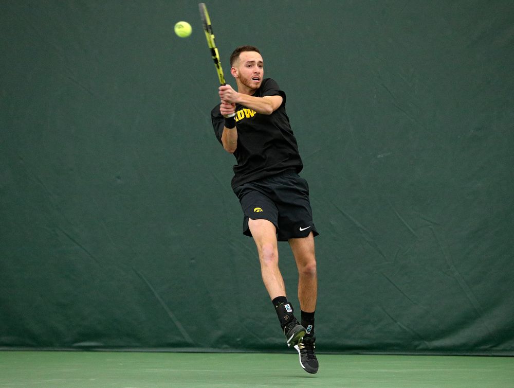Iowa’s Kareem Allaf returns a shot during his singles match at the Hawkeye Tennis and Recreation Complex in Iowa City on Friday, February 14, 2020. (Stephen Mally/hawkeyesports.com)