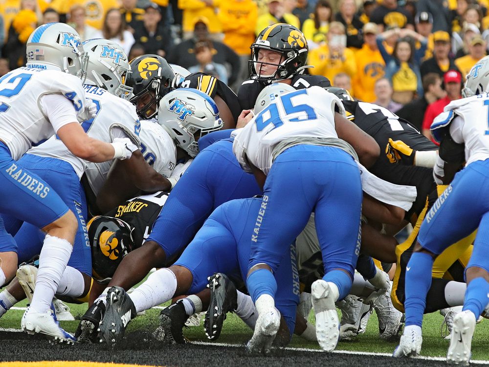 Iowa Hawkeyes quarterback Spencer Petras (7) scores a touchdown on a 1-yard run during fourth quarter of their game at Kinnick Stadium in Iowa City on Saturday, Sep 28, 2019. (Stephen Mally/hawkeyesports.com)