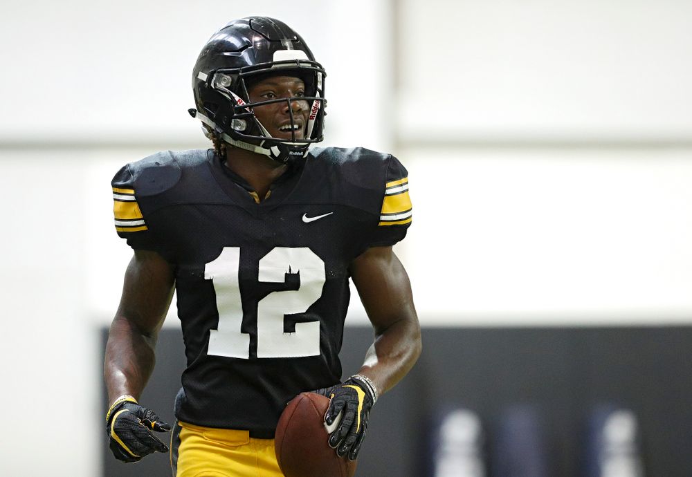 Iowa Hawkeyes wide receiver Brandon Smith (12) smiles after pulling in a pass during Fall Camp Practice No. 6 at the Hansen Football Performance Center in Iowa City on Thursday, Aug 8, 2019. (Stephen Mally/hawkeyesports.com)