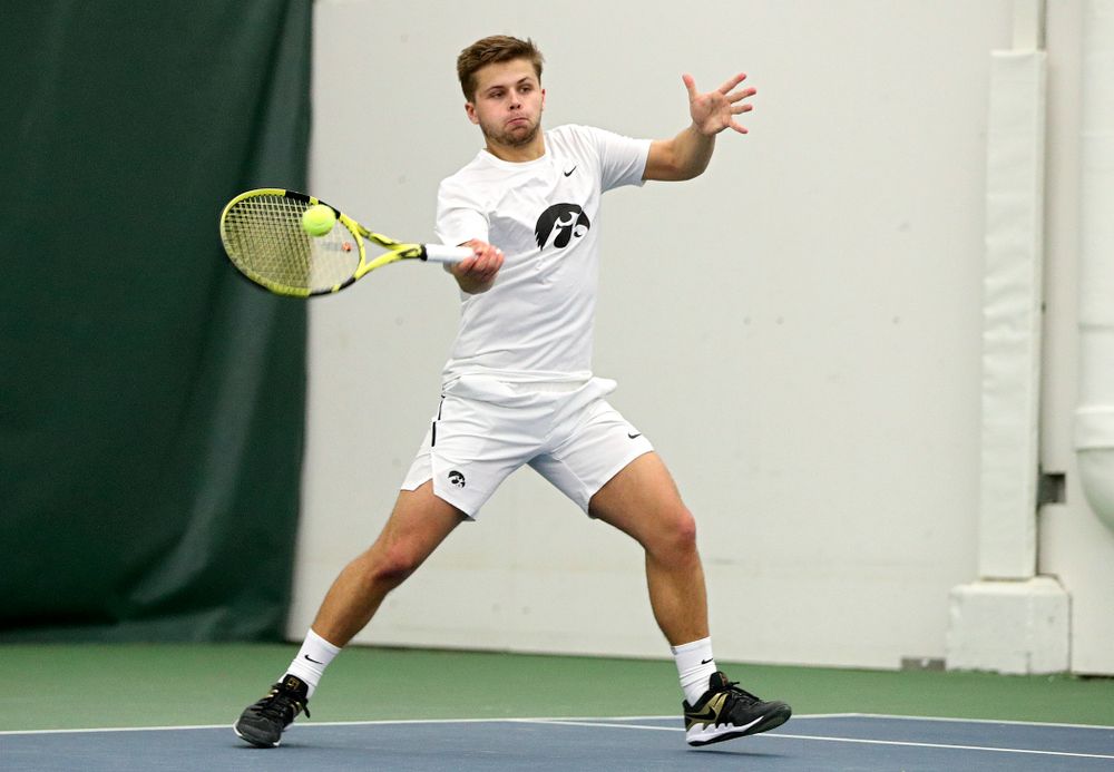 Iowa’s Will Davies returns a shot during his singles match at the Hawkeye Tennis and Recreation Complex in Iowa City on Sunday, February 16, 2020. (Stephen Mally/hawkeyesports.com)