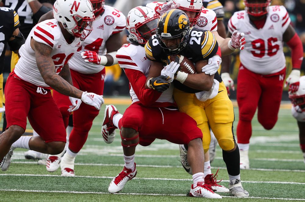 Iowa Hawkeyes running back Toren Young (28) runs the ball during a game against Nebraska at Kinnick Stadium on November 23, 2018. (Tork Mason/hawkeyesports.com)