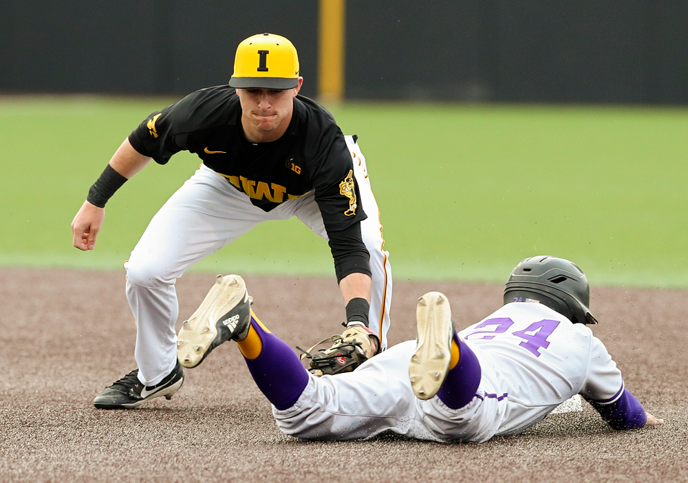 Iowa Hawkeyes shortstop Tanner Wetrich (16) tags out a runner trying to steal during the first inning of their game against Western Illinois at Duane Banks Field in Iowa City on Wednesday, May. 1, 2019. (Stephen Mally/hawkeyesports.com)