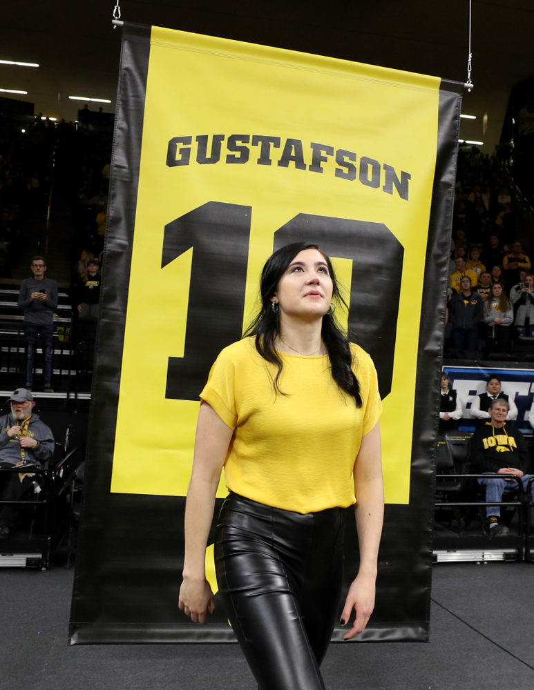 Megan Gustafson stands with her family as her number is raised into the rafters during a jersey retirement ceremony Sunday, January 26, 2020 at Carver-Hawkeye Arena. (Brian Ray/hawkeyesports.com)